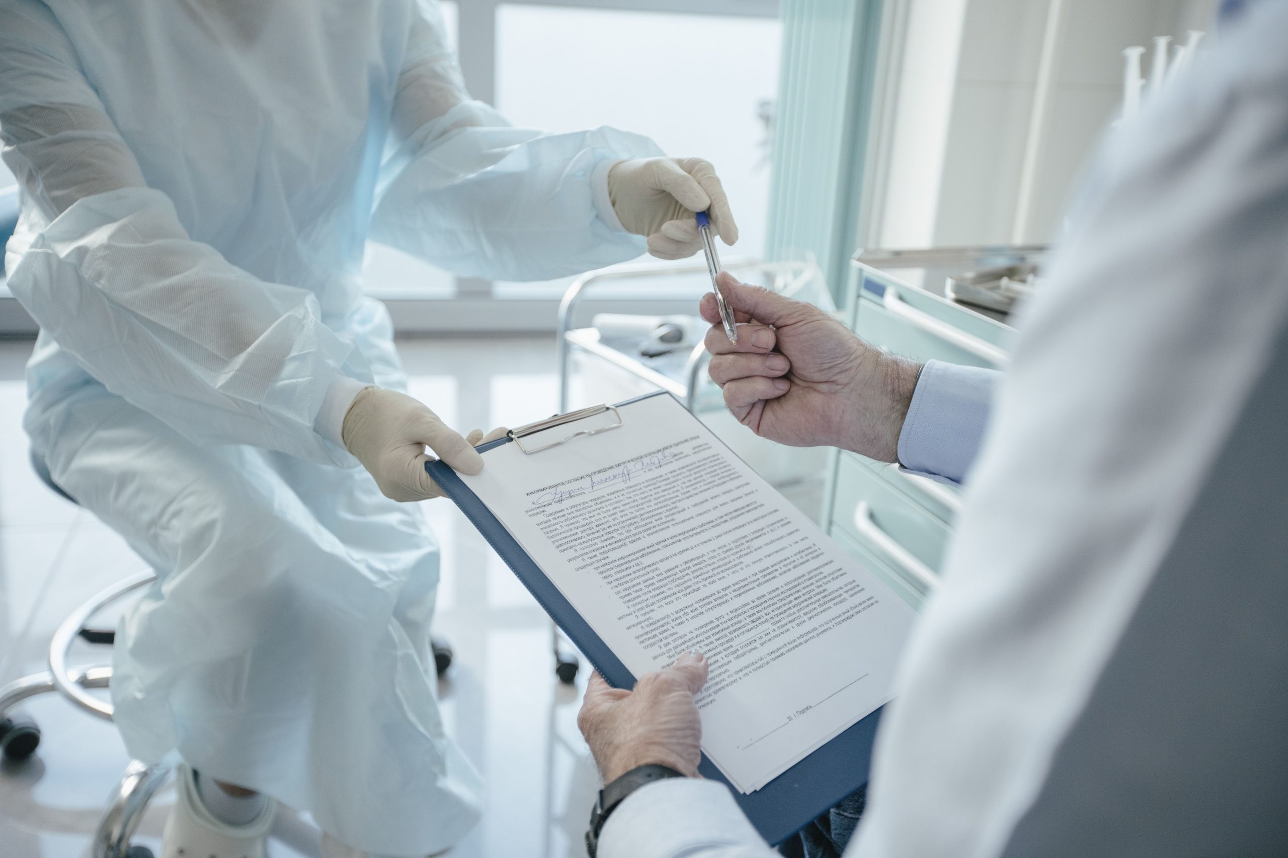 medical clinic loan agreement,patient signing credit documents,lawyer consultation healthcare,bank loan refusal form,doctor consultation clinic